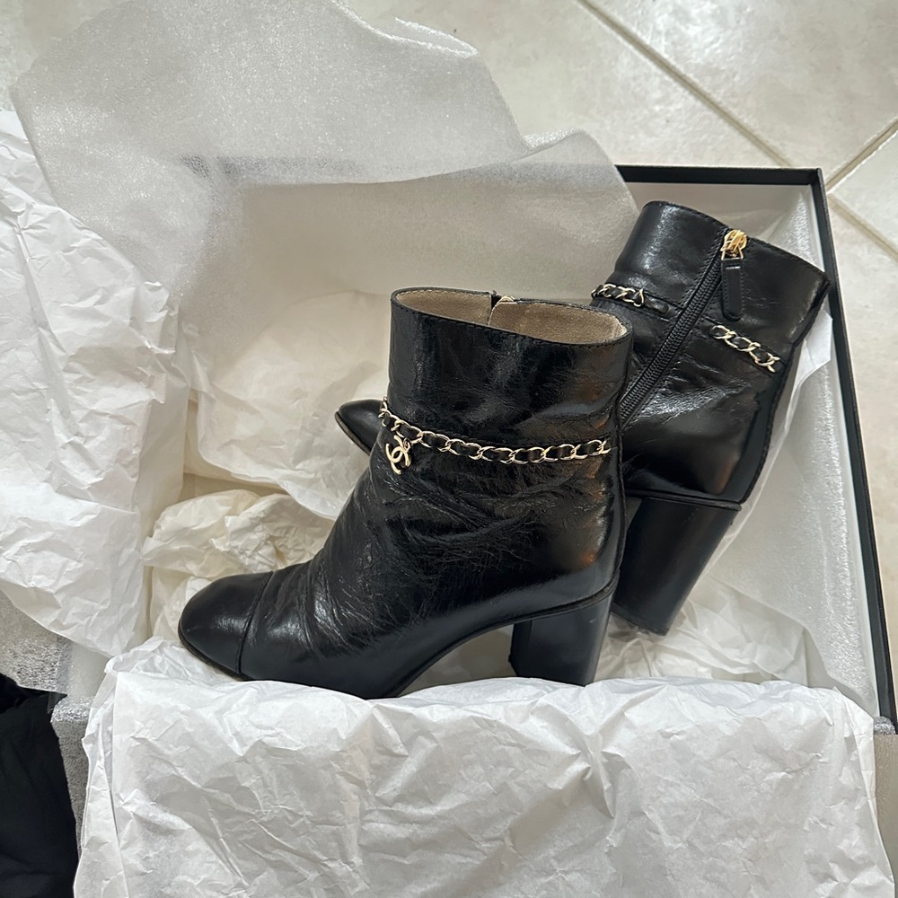 CHANEL Black Ankle Boots with Gold Chain Accent